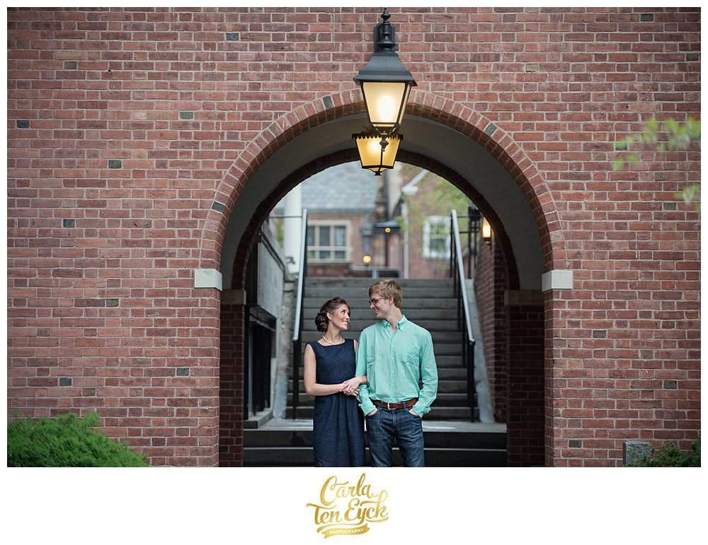 A couple smiles during their engagement session at Yale in New Haven CT
