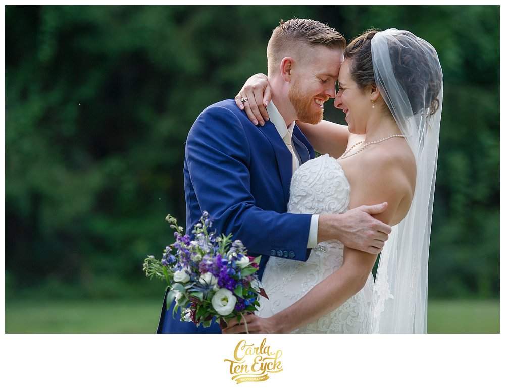 A couple embraces after their wedding at The Webb Barn in Wethersfield CT