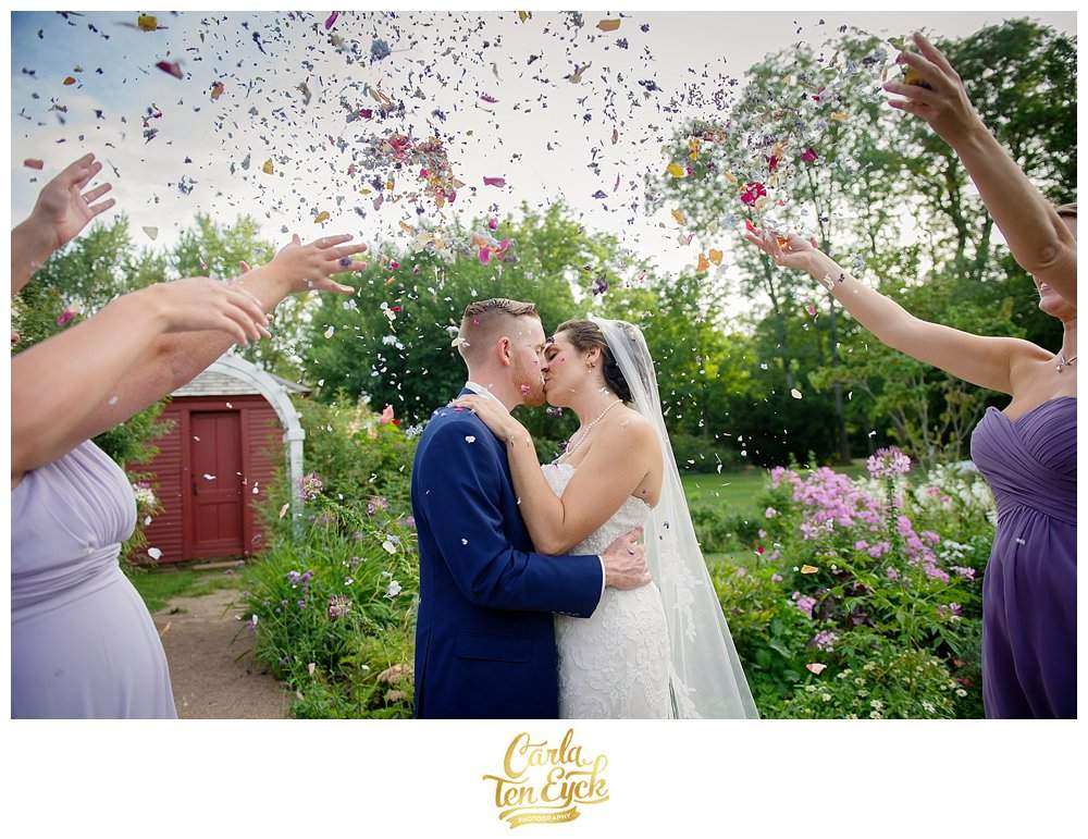 Flower petals are thrown after a wedding at the Webb Barn in Wethersfield CT