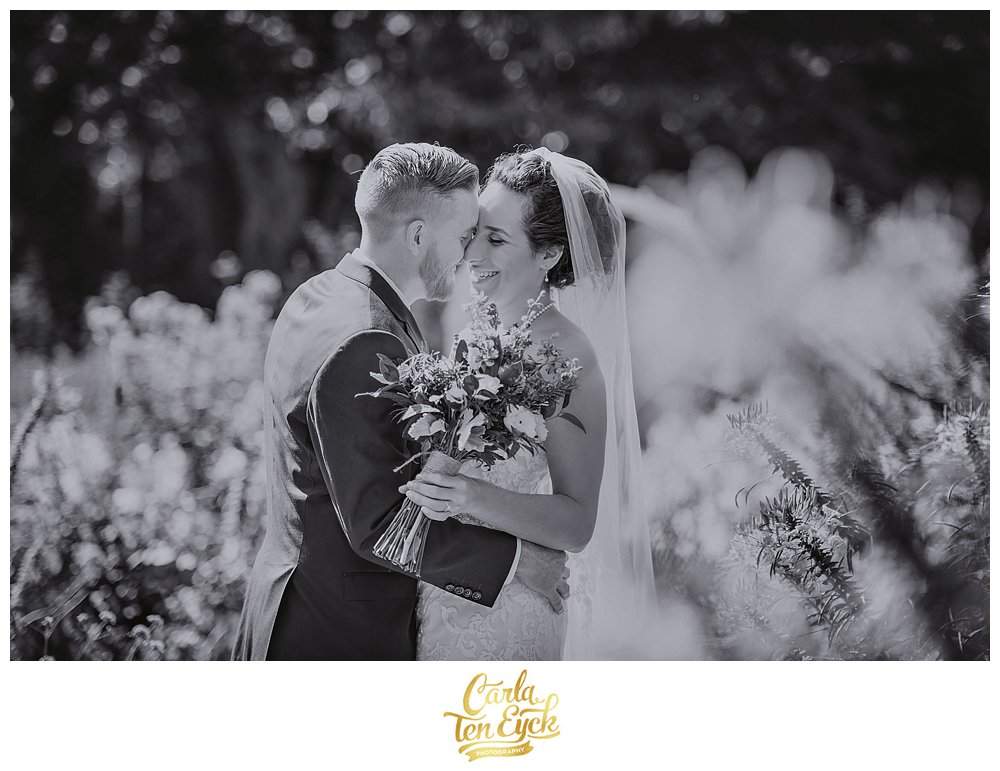 A couple embraces in the gardens of the Webb Barn in Wethersfield CT