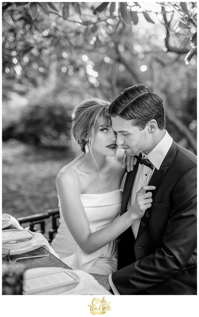 A bride and groom snuggle at a styled shoot at the Copper Beech Inn in Ivoryton CT