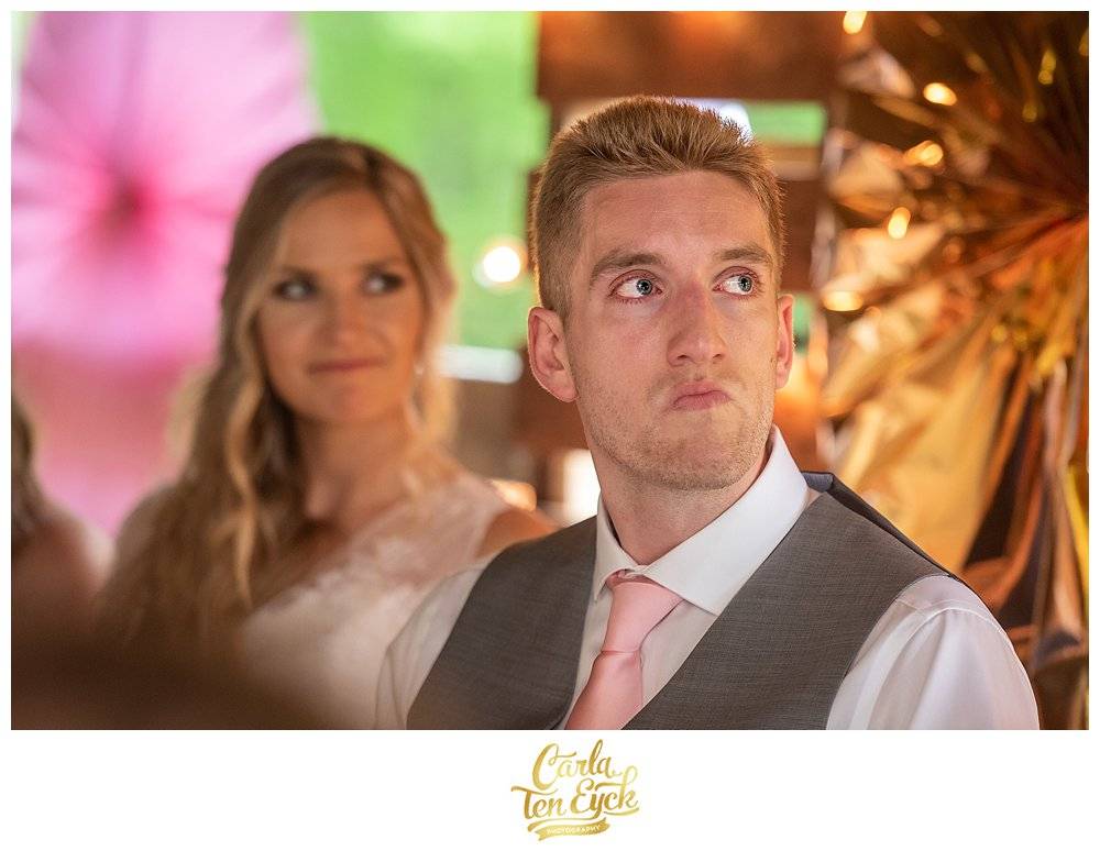 Groom tearing up during an emotional wedding toast.