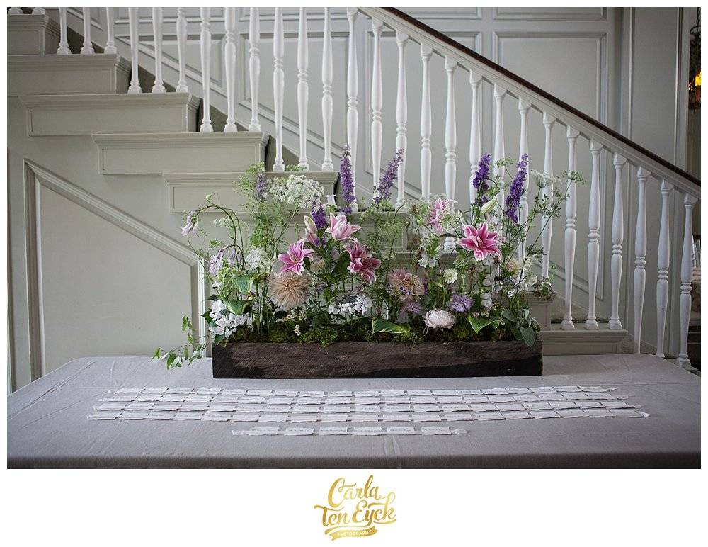 Escort card table with lilies at Harkness Park, Waterford CT wedding with Carrie Wilcox Floral Design