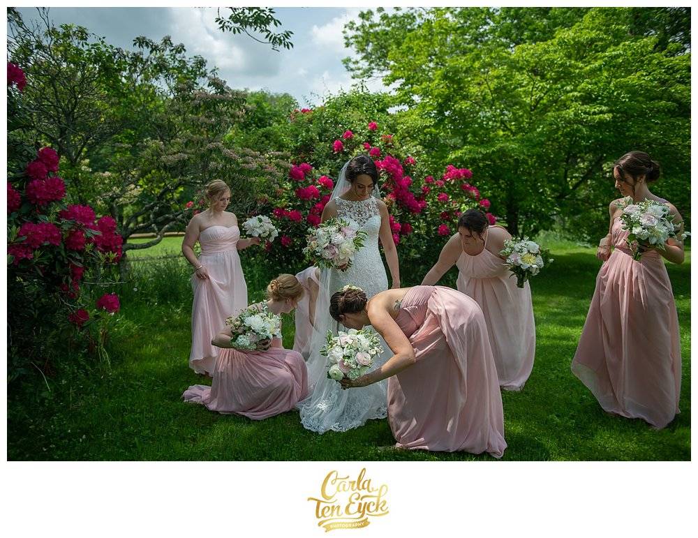 Bride in lace Maggie Sottero wedding gown with her bridesmaids in pink dresses at Tyrone Farm, Pomfret CT