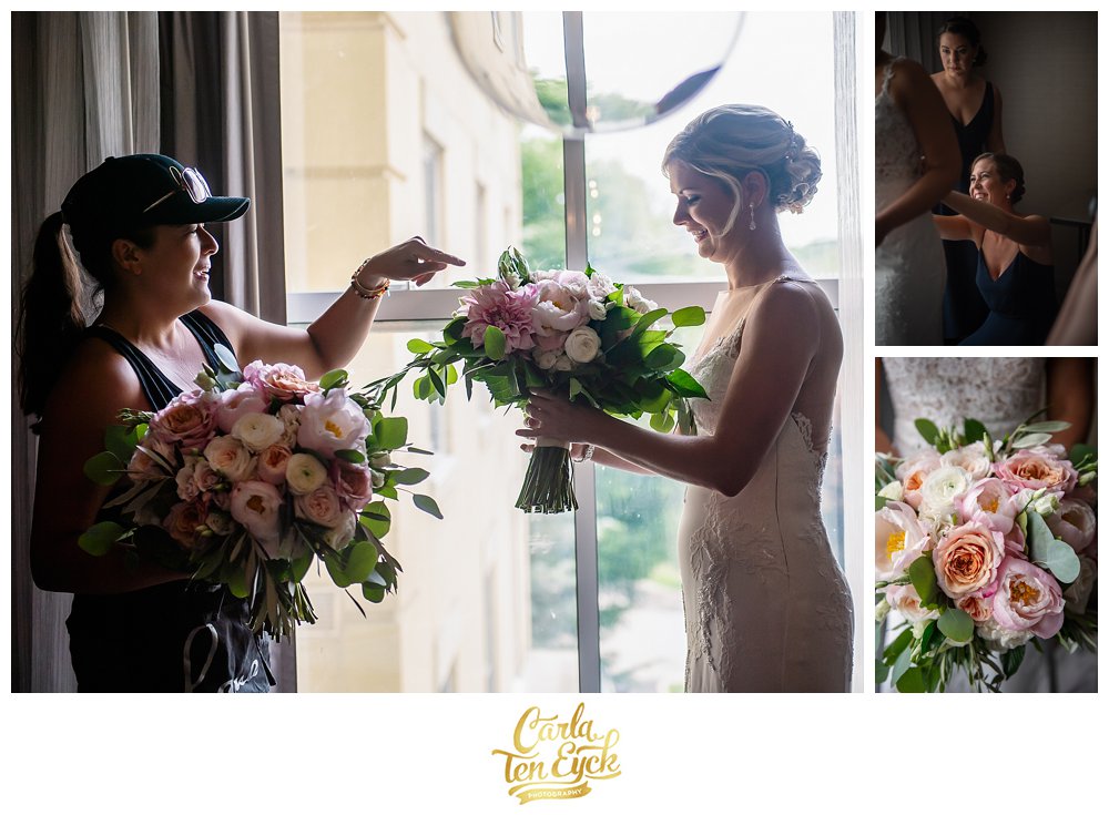 Hana Floral showing the bride their wedding day bouquet for the first time at Jonathan Edwards Winery North Stonington CT