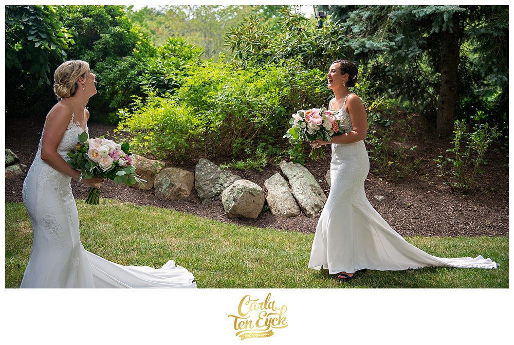 Tow brides reacting at their first look on their wedding day at Jonathan Edwards Winery North Stonington CT