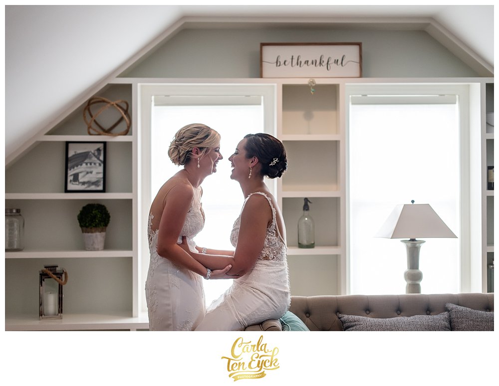 Bridal suite at Jonathan Edwards Winery with two brides laughing