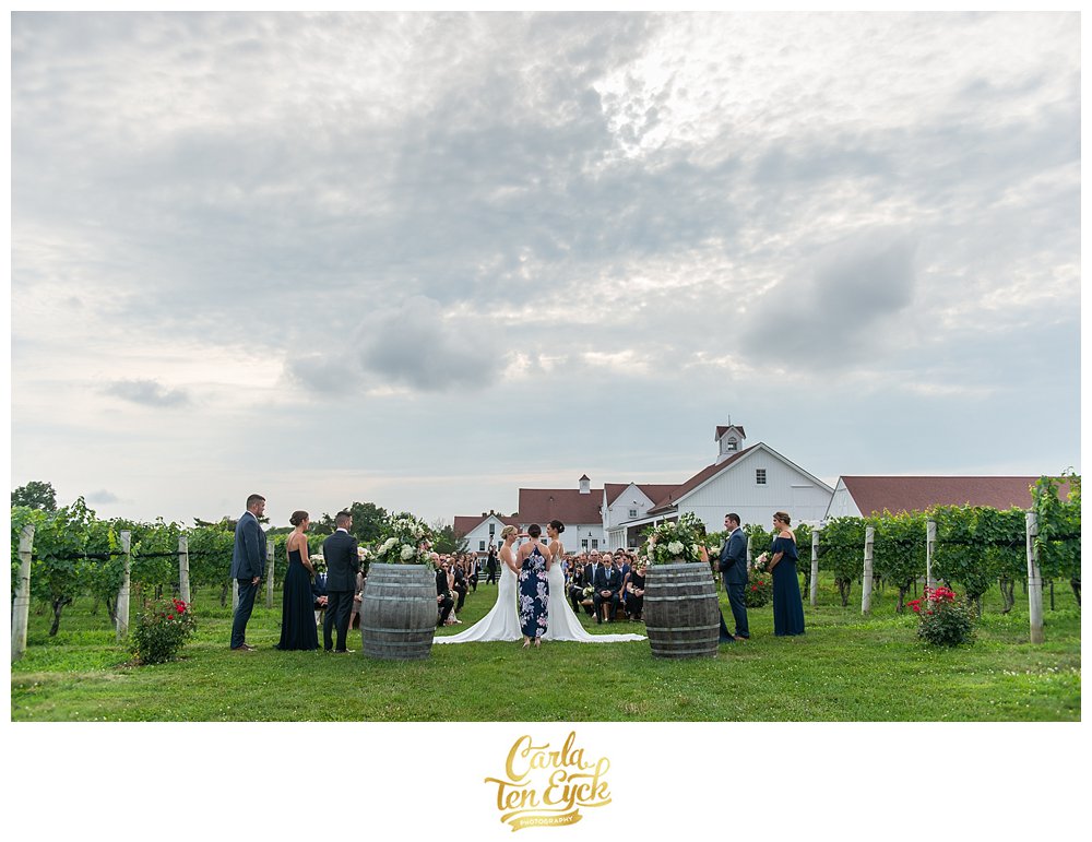 Wedding ceremony for two brides at Jonathan Edwards Winery in North Stonington CT