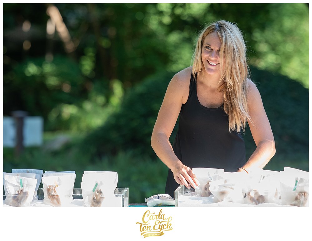 Amy Jones of Amy Champagne Events smiling at her tented wedding in Norwalk CT