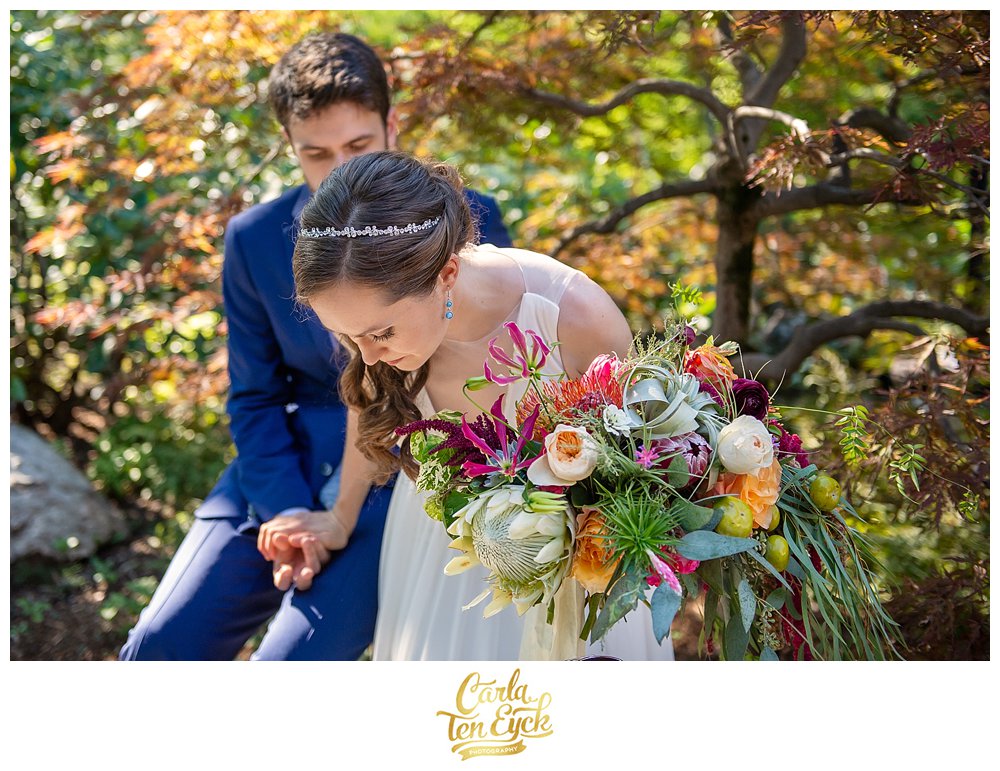 Wedding bouquet with protea garden roses dahlias airplanes by Carrie Wilcox Floral Design Fairfield CT