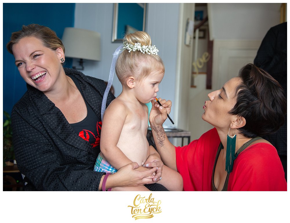 Flower girl gets makeup on her aunt's wedding day by Catie Bane