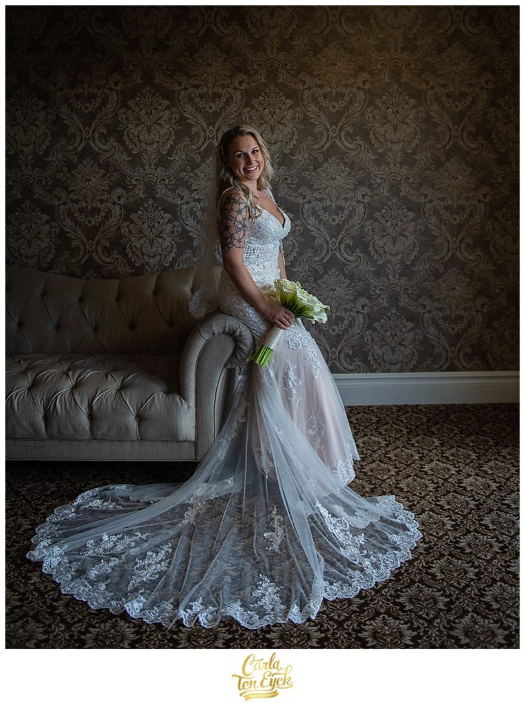 Bride smiles in her Stella York wedding gown on her wedding day at Aria in Prospect CT