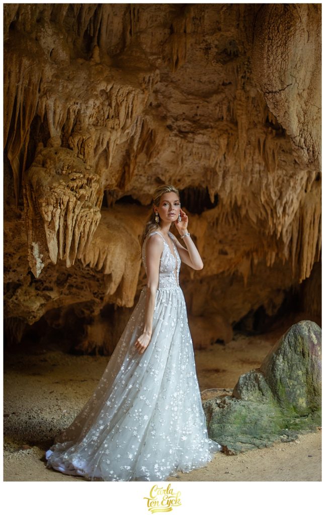 Bride in starry wedding gown in the Crystal Caves on Grand Cayman for Cayman Vows Magazine