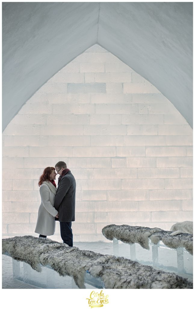 A couple kisses at the Hotel de Glace or Ice Hotel in Montreal Quebec