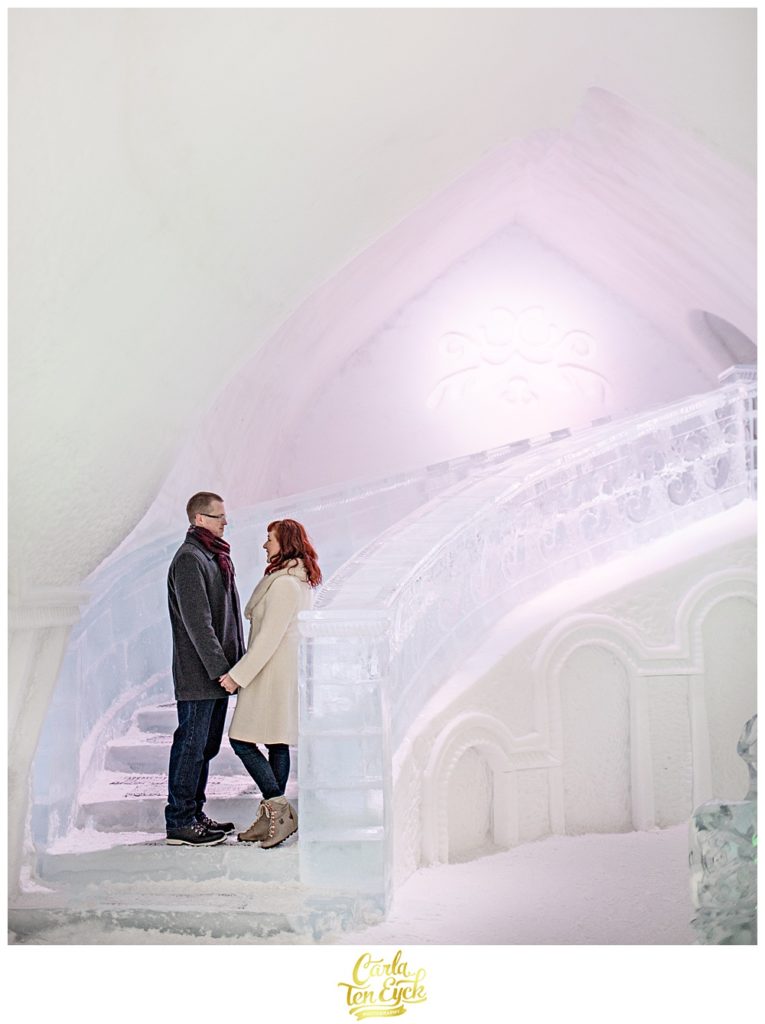 Couple on the ice stairs at the ice Hotel de Glace in Montreal Quebec