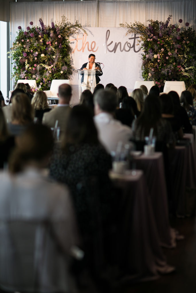 Carla Ten Eyck laughs during her talk at The Knot Pro in Boston MA