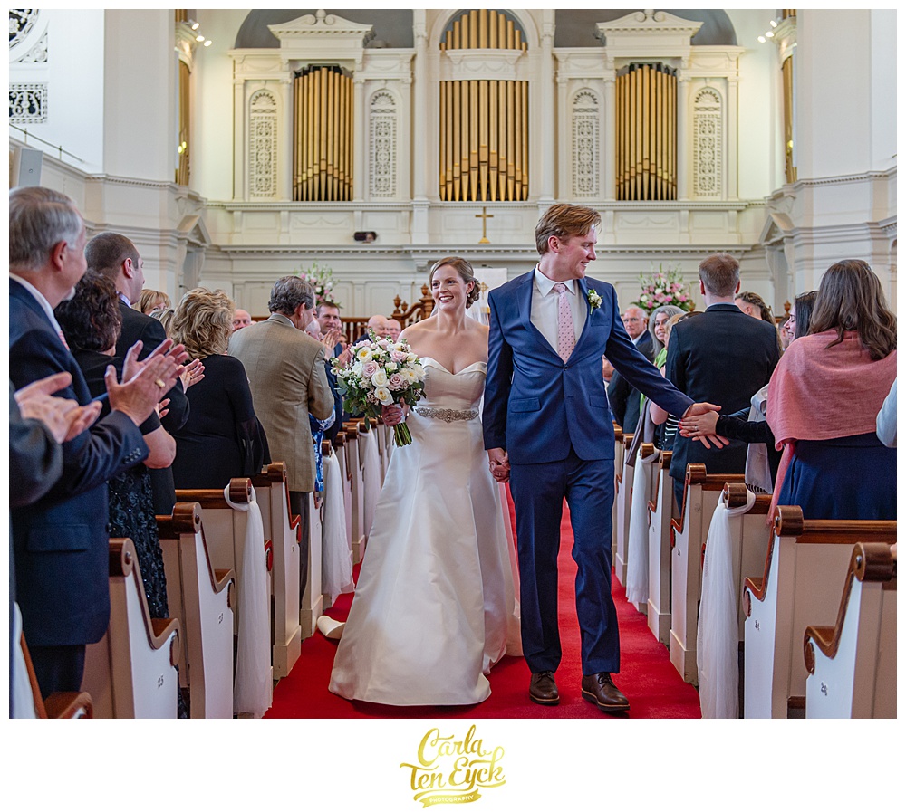 Bride and groom walk happily down the aisle after their wedding at First Congregational Church in Danbury CT
