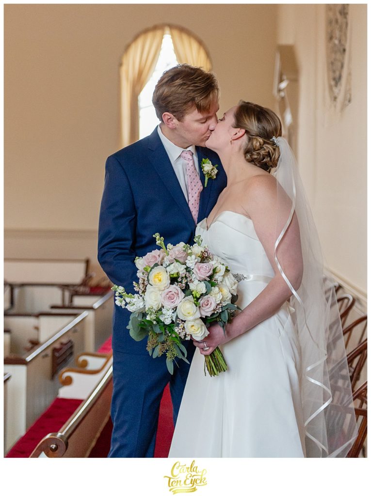 Bride and groom kiss at their wedding at First Congregational Church in Danbury.