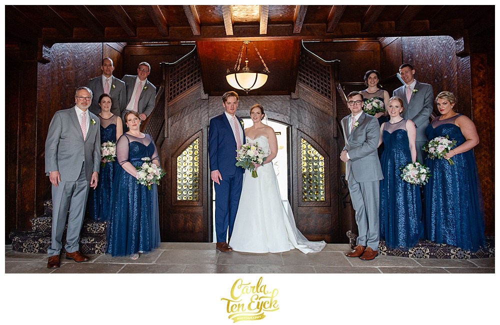 Wedding party in grey suits and navy sequin bridesmaids dresses at Le Chateau in South Salem NY