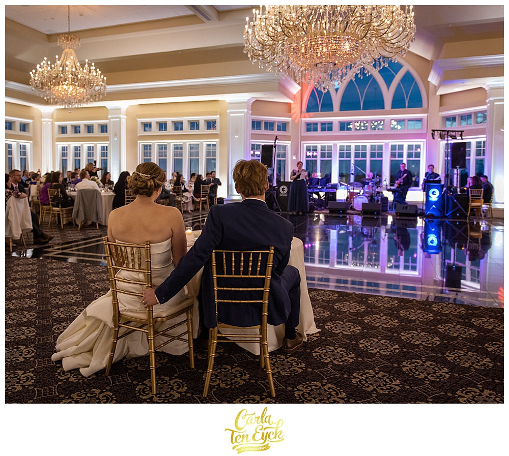 Bride and groom listen to toasts at their wedding at Le Chateau South Salem NY