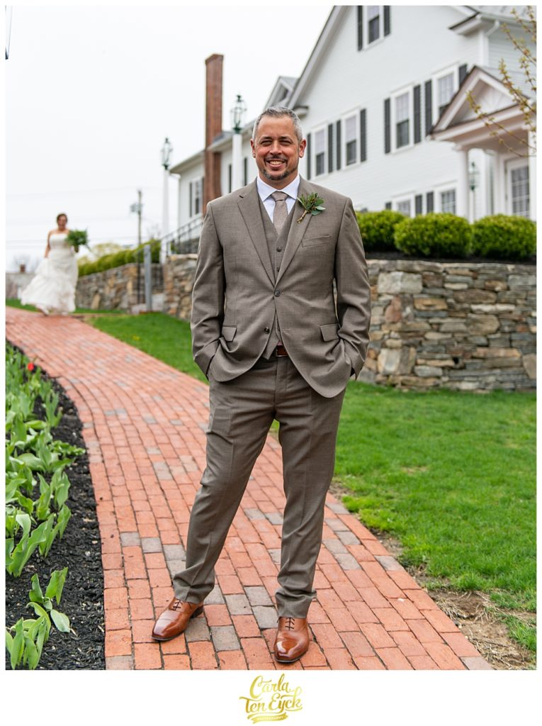A groom waits for his bride at their first look at their wedding at the Publick House in Sturbridge MA