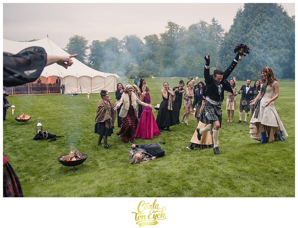 Guest catches a bouquet at a wedding at Mount Stuart on the Isle of Bute Scotland