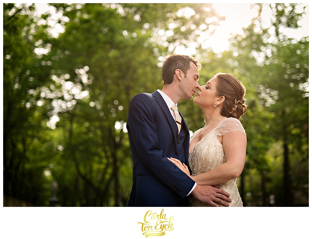 Bride and groom kiss in the Boston Public Gardens in Boston MA