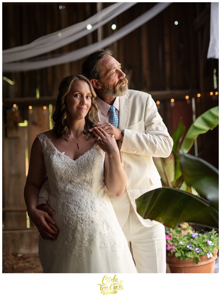 Bride and groom in the tobacco barn after their backyard CT wedding