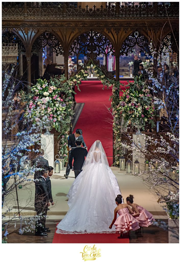 Bride walks down the aisle at her wedding at Selby Abbey Yorkshire UK