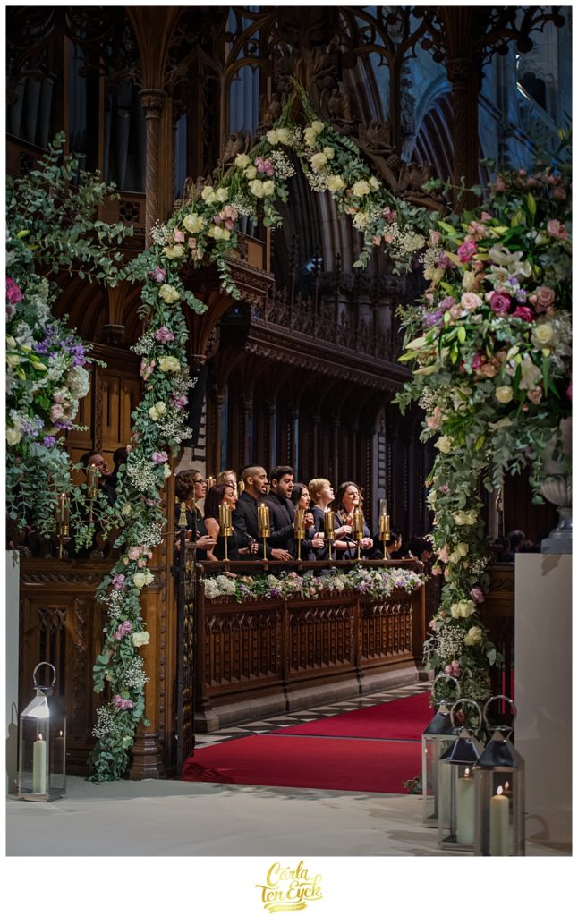 A choir sings at a wedding ceremony at Selby Abbey Yorkshire UK