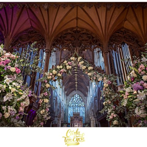 Florals on the altar for a wedding at Selby Abbey in Yorkshire UK