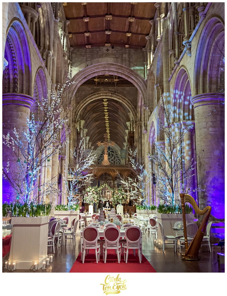 The aisle of Selby Abbey is transformed for a wedding in Yorkshire UK with Sarah Haywood