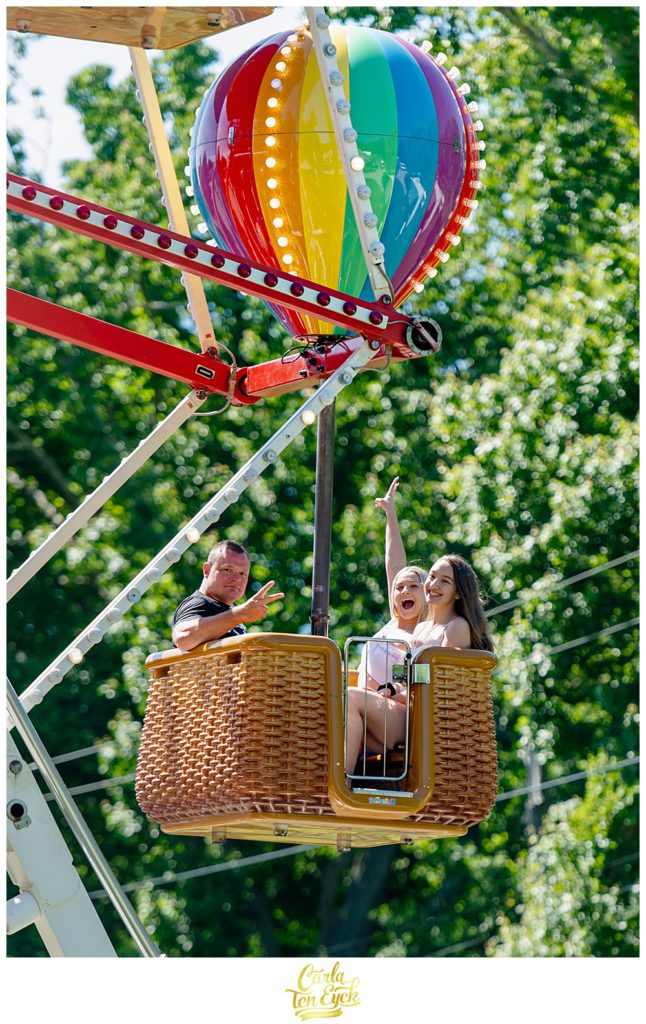 Guests ride a Ferris wheel at a carnival themed graduation party in Niantic CT