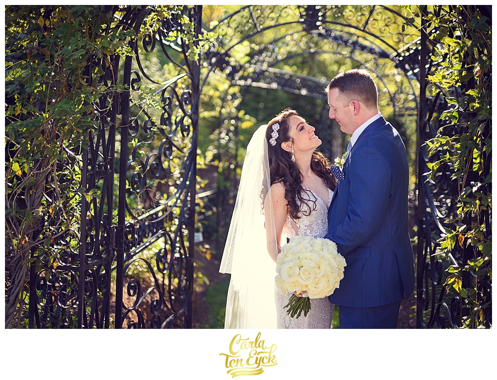 A bride and groom snuggle during their wedding at Aria in Prospect CT