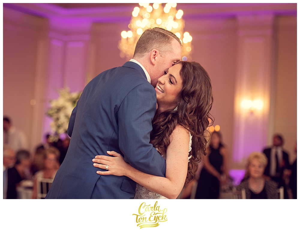 A bride laughs during their first dance at Aria in Prospect CT