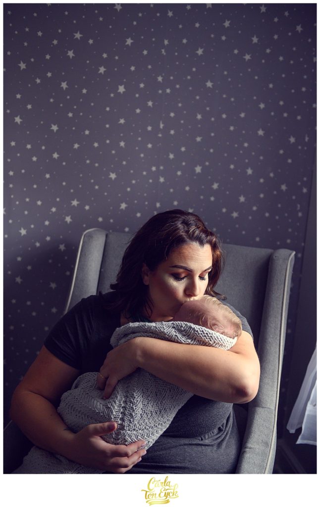 A new mom kisser her newborn son at heir him in Old Lyme CT