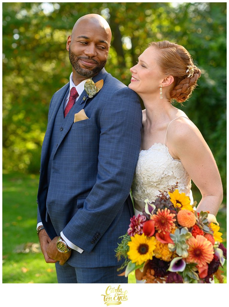 A bride and groom snuggle at The Spa at Norwich Inn wedding Norwich CT