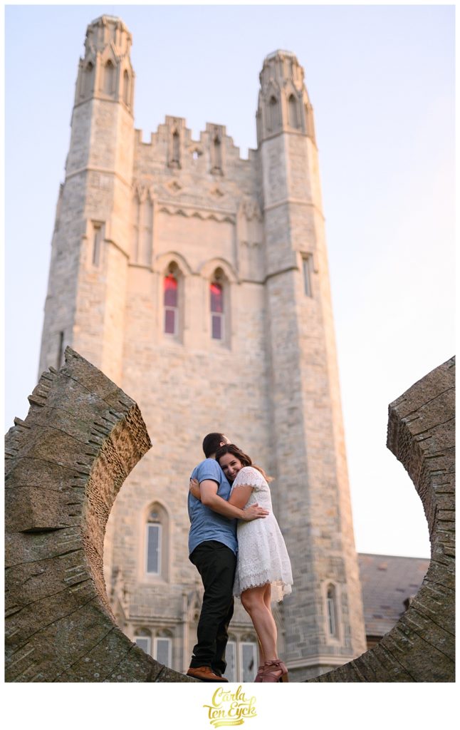 A couple snuggles on a sculpture at the UCONN Law School in Hartford CT