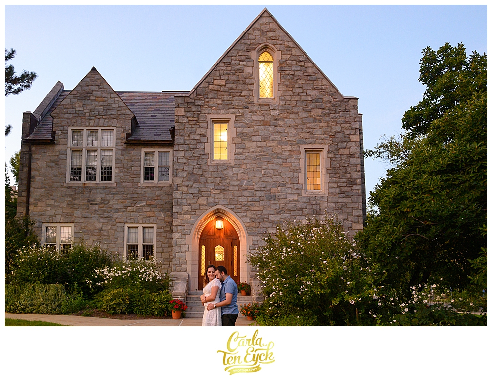 A couple embraces during their engagement session at the UCONN Law School Campus in Hartford CT