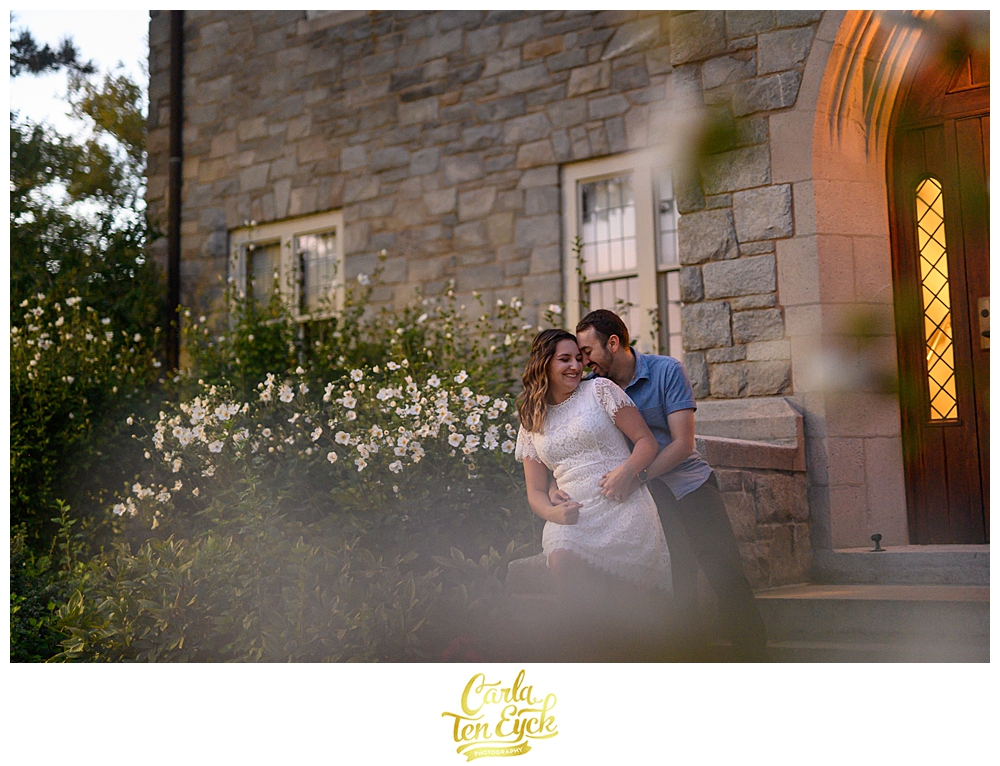A couple laughs during their engagement session at the UCONN Law School in Hartford CT