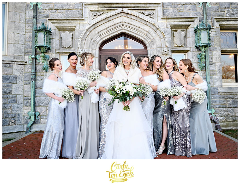 Bridesmaids in silver and white faux fur at a winter wedding at the Branford House in groton CT