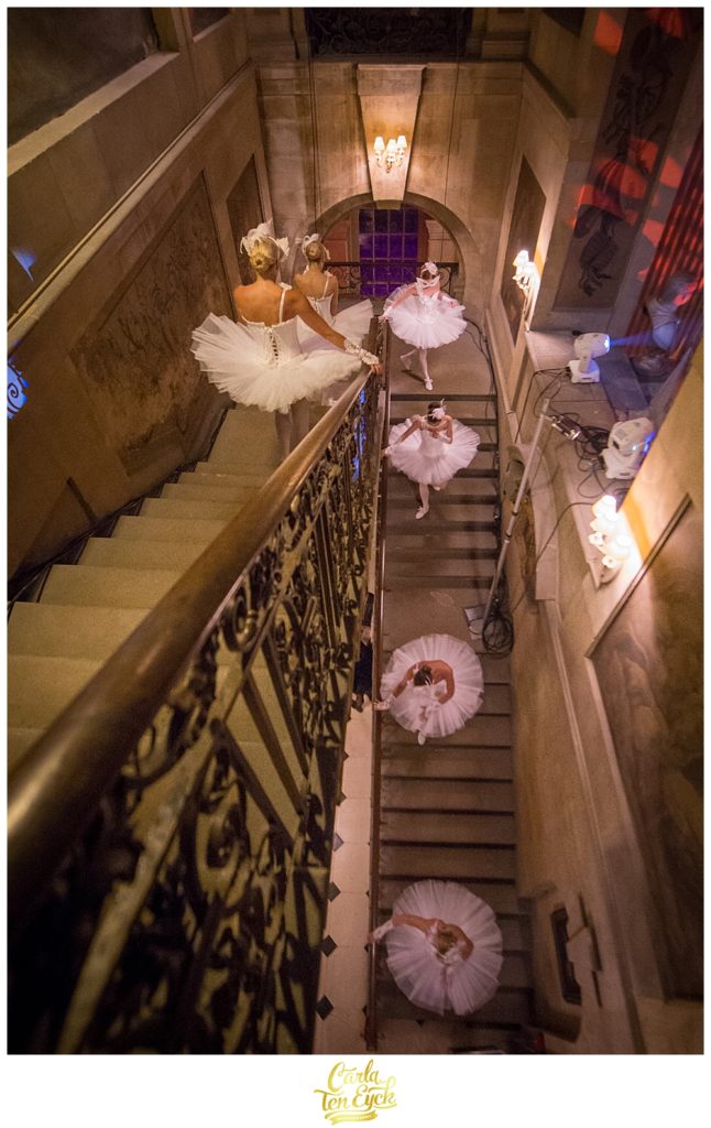 Ballerinas descend the stairs at a performance at a wedding at Castle Howard in North Yorkshire England