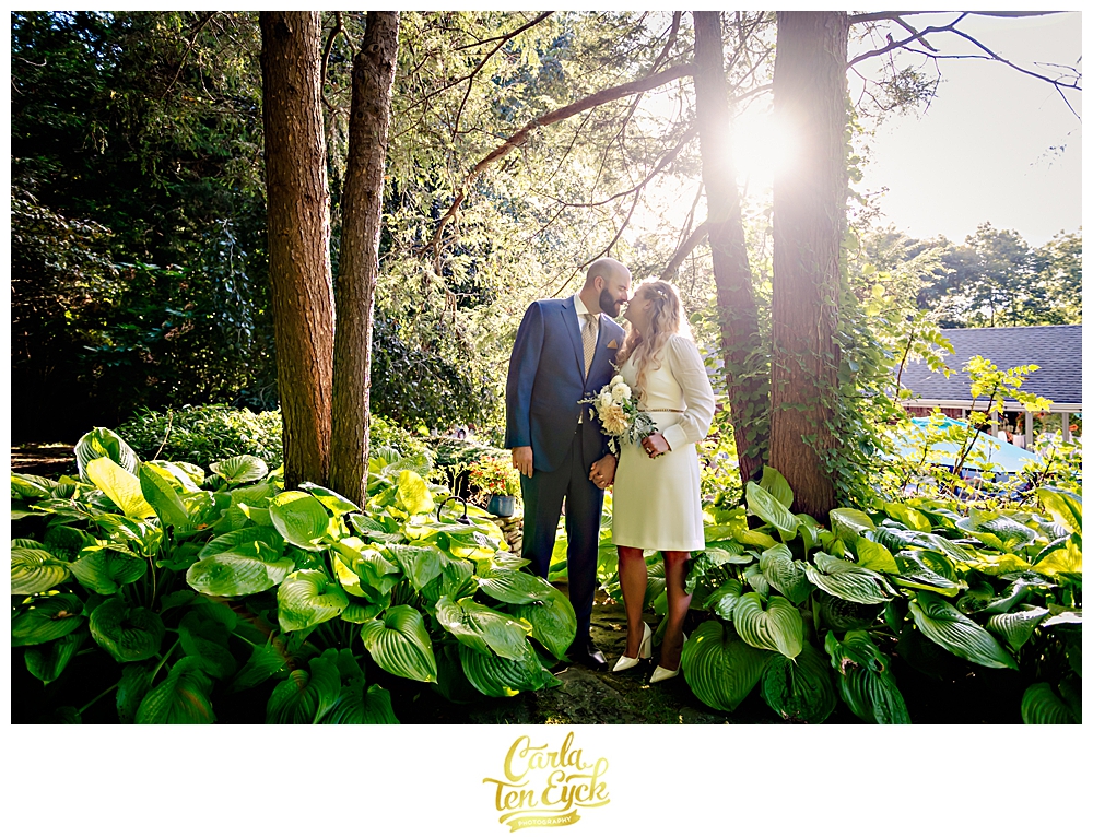 Bride and groom celebrate in their back yard during their intimate wedding in NY