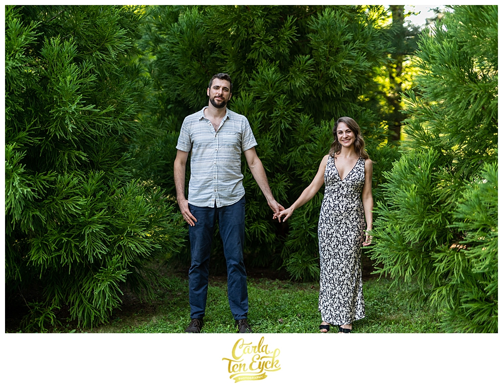 Couple poses for a photo in the woods of Chatfield Hollow Inn in Killingworth CT