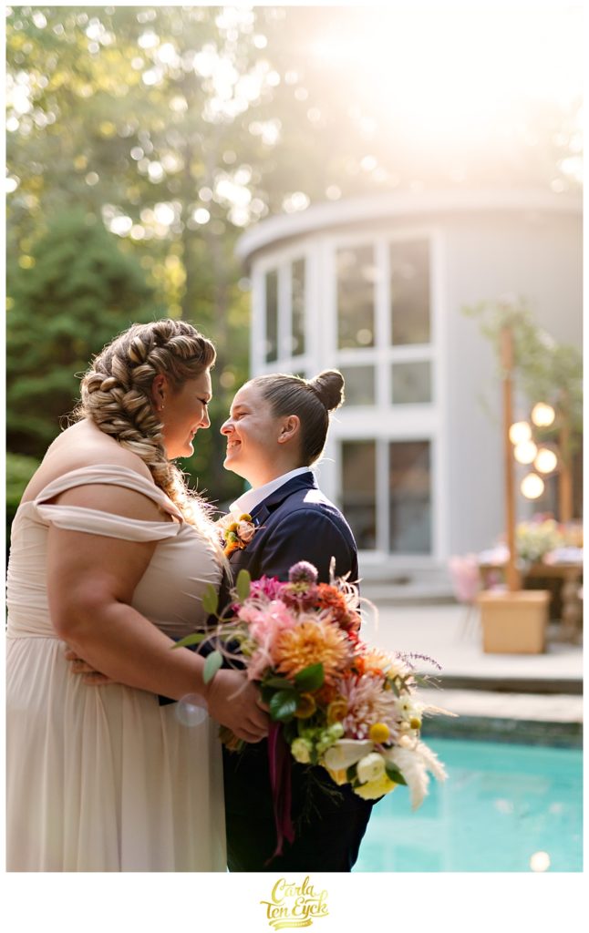 Two brides pose for photos during their LGBTQ wedding in Weston CT