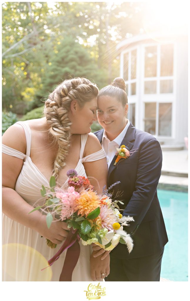 Two brides pose for photos during their LGBTQ wedding in Weston CT