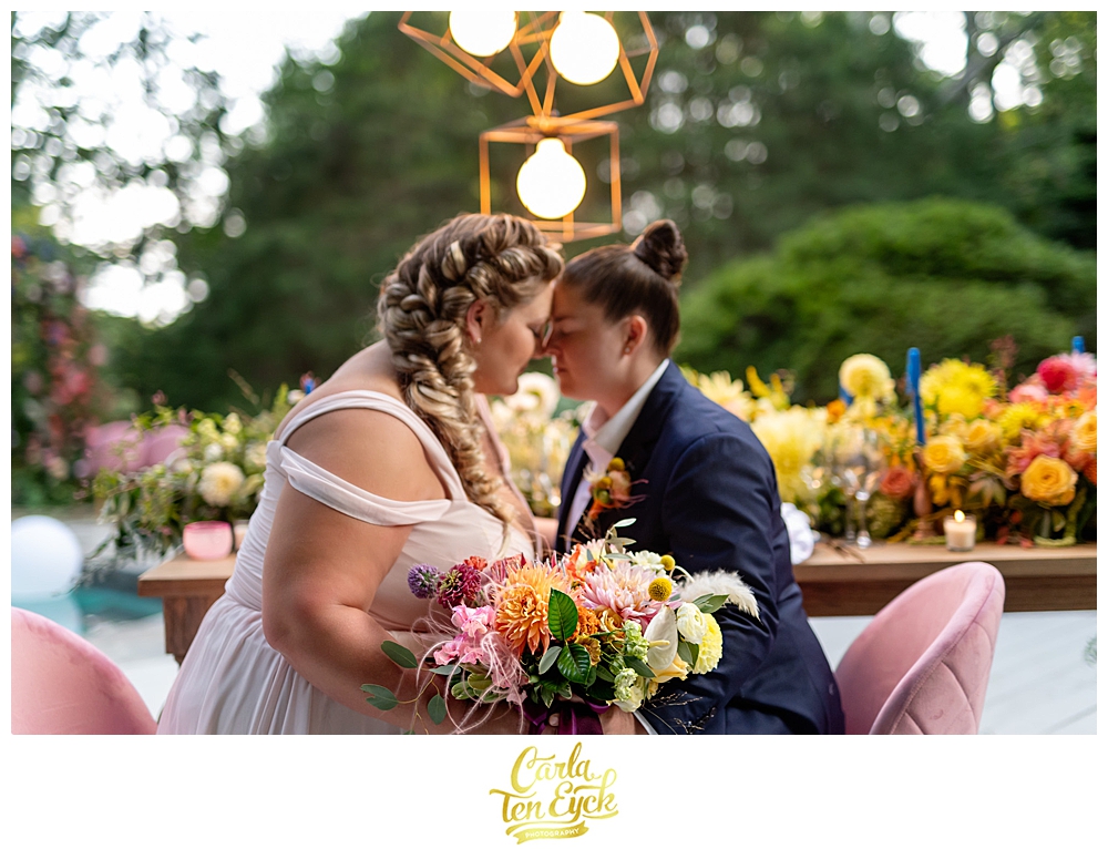 Two brides kiss at their LGBTQ Wedding with Amy Champagne Events