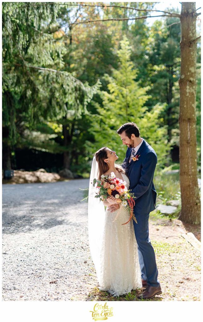 A bride and groom laugh during wedding portraits at their Chatfield Hollow Inn Wedding in Killingworth CT