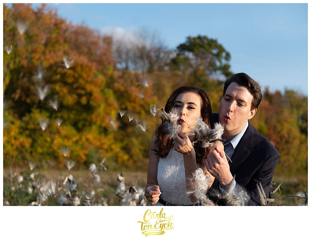 A couple plays during their engagement session at Smith Farm Gardens in East Haddam CT