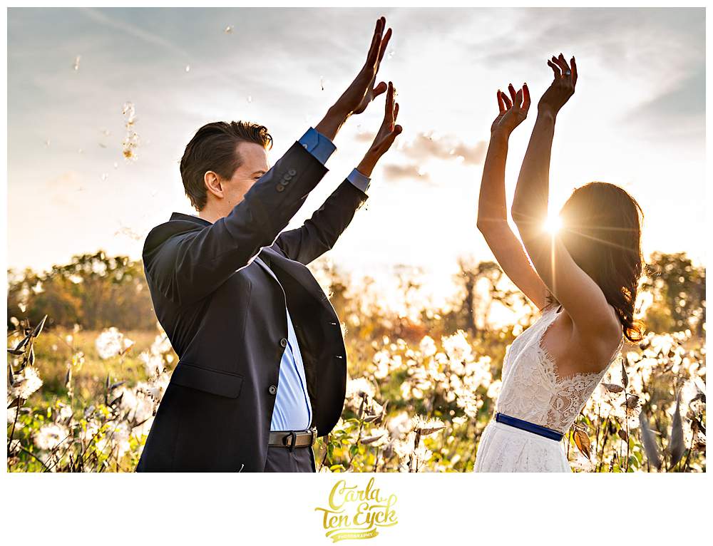 A couple in the milkweed during their engagement session at Smith Farm Gardens in East Haddam CT